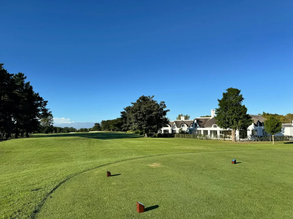Sunny golf course with green fairways at a holiday resort