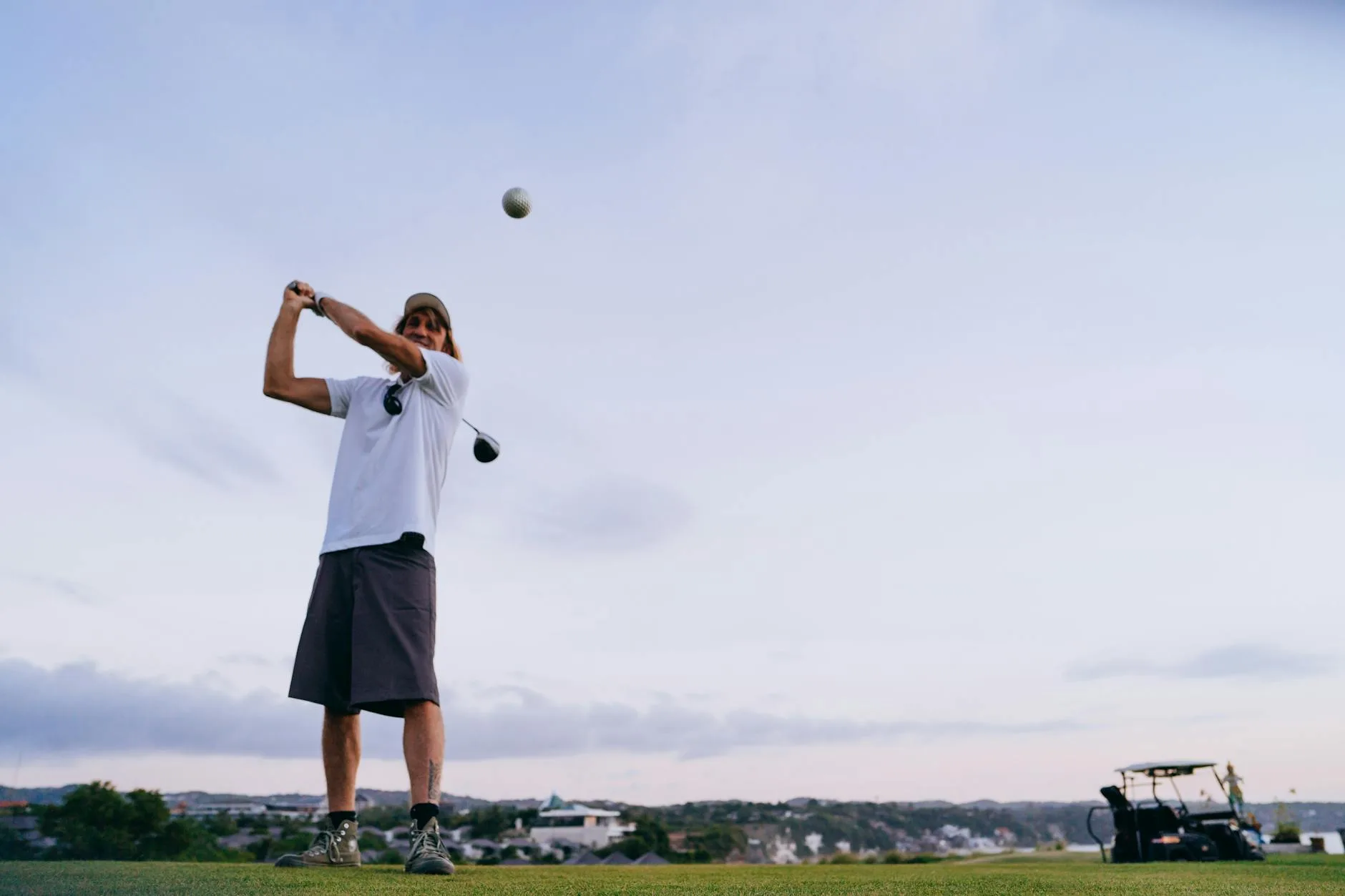 Golf ball in flight against the sky