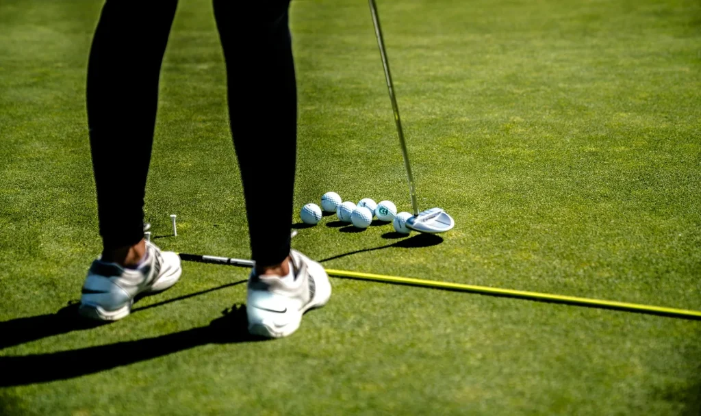 Set of clean golf irons lined up in a bag