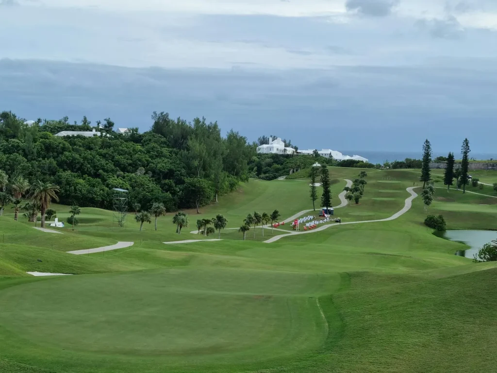 Scenic golf course at a holiday resort with ocean views and palm trees