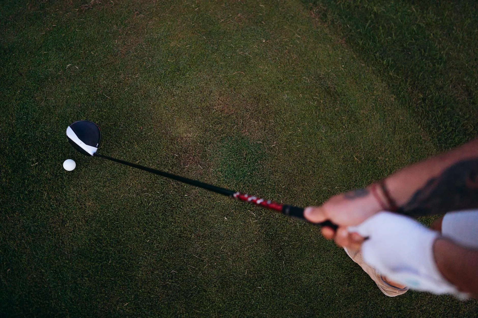 Golfer hitting a driver off the tee on a UK golf course