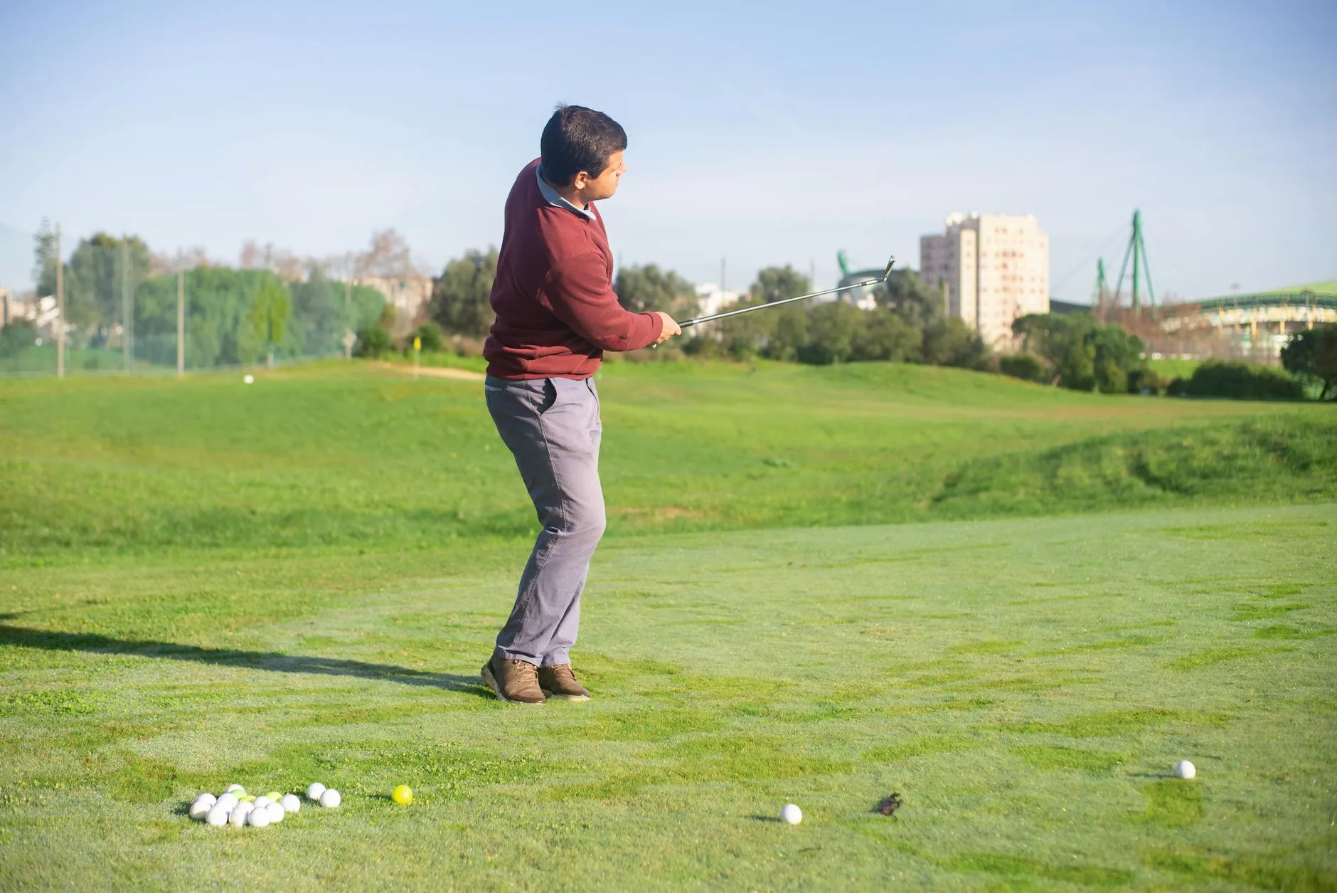 Golfer hitting a shot during a club fitting session