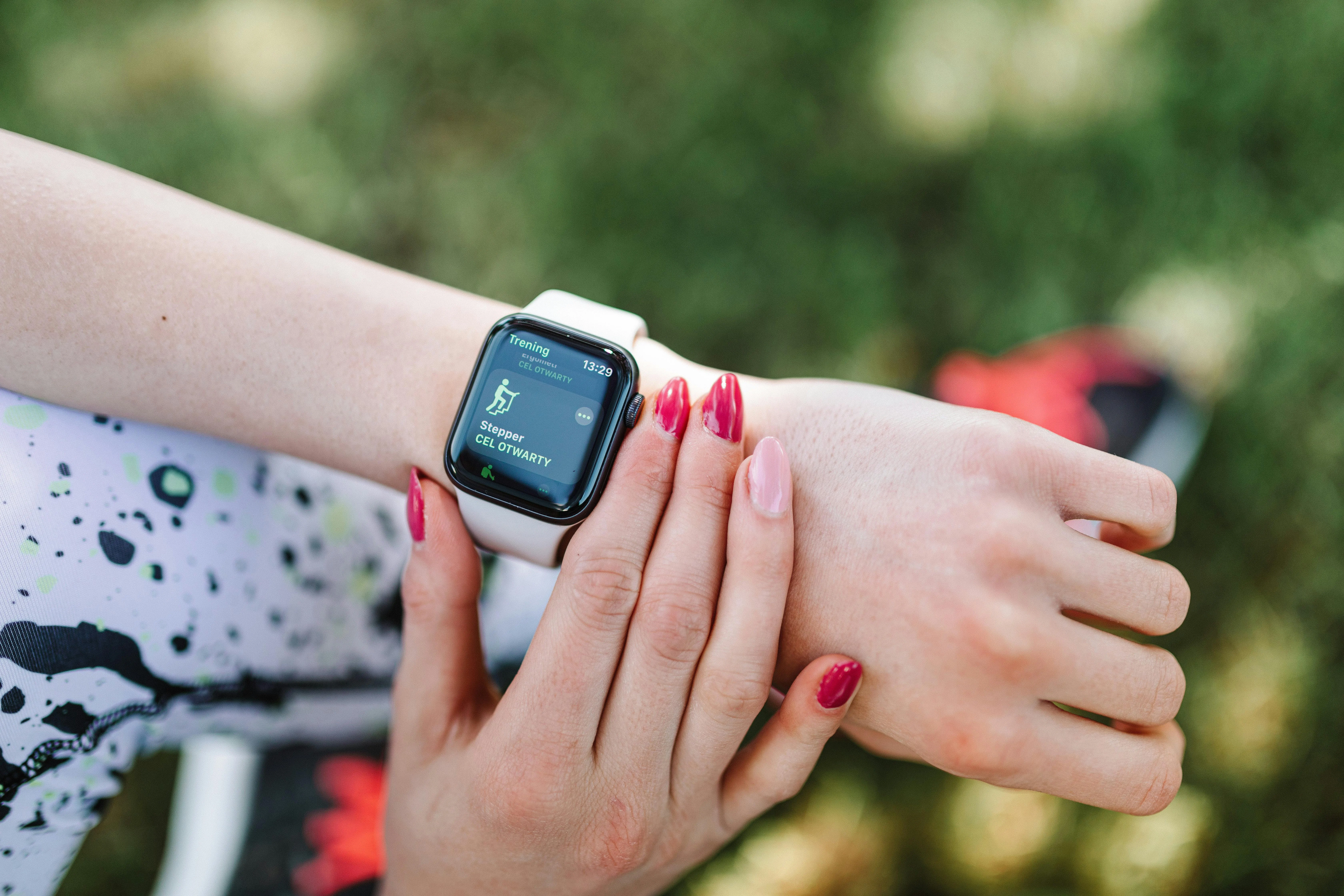Close-up of a sport smartwatch being used outdoors for fitness tracking