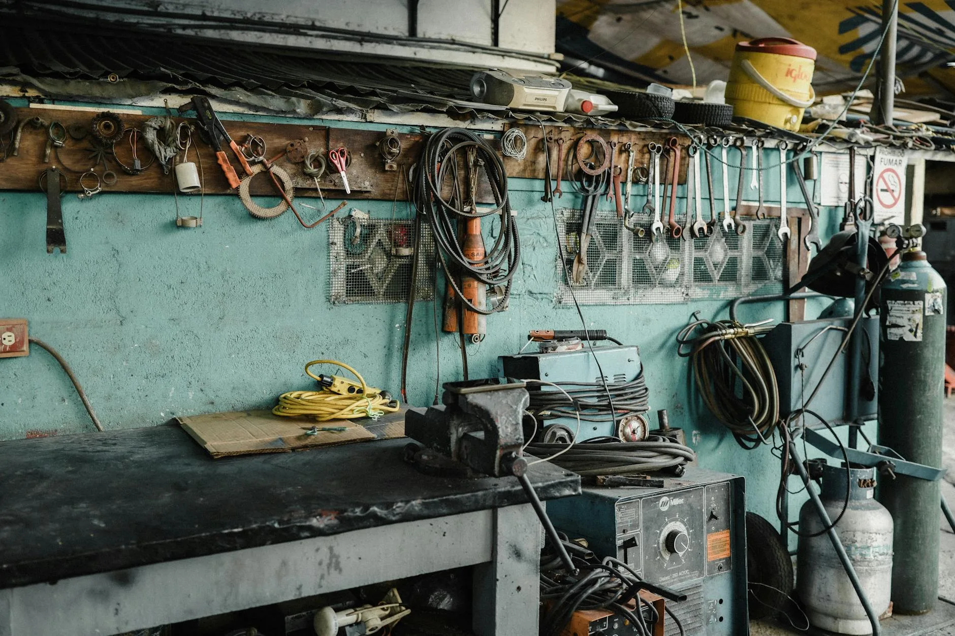 Golf club repair workshop with tools and workbench