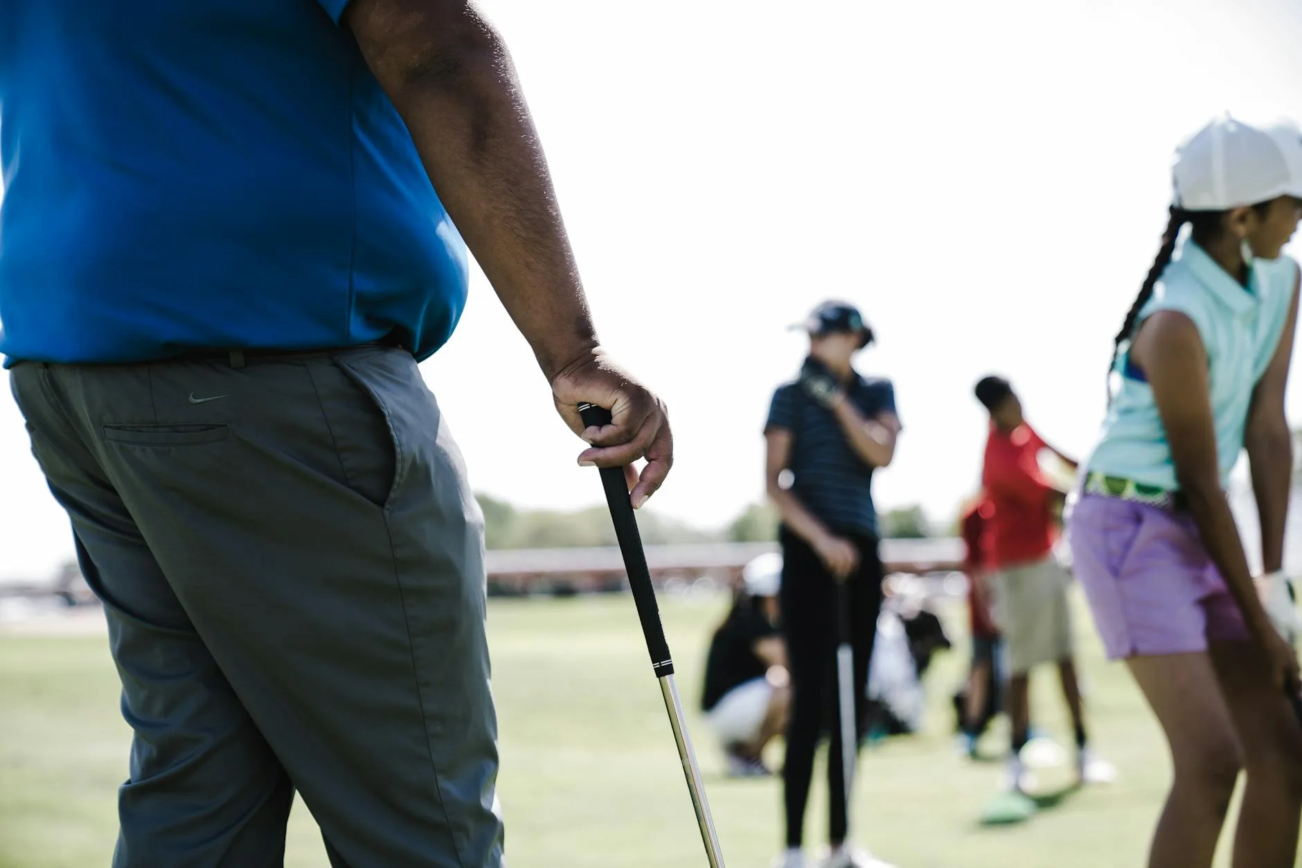 Golfer gripping a club during a swing