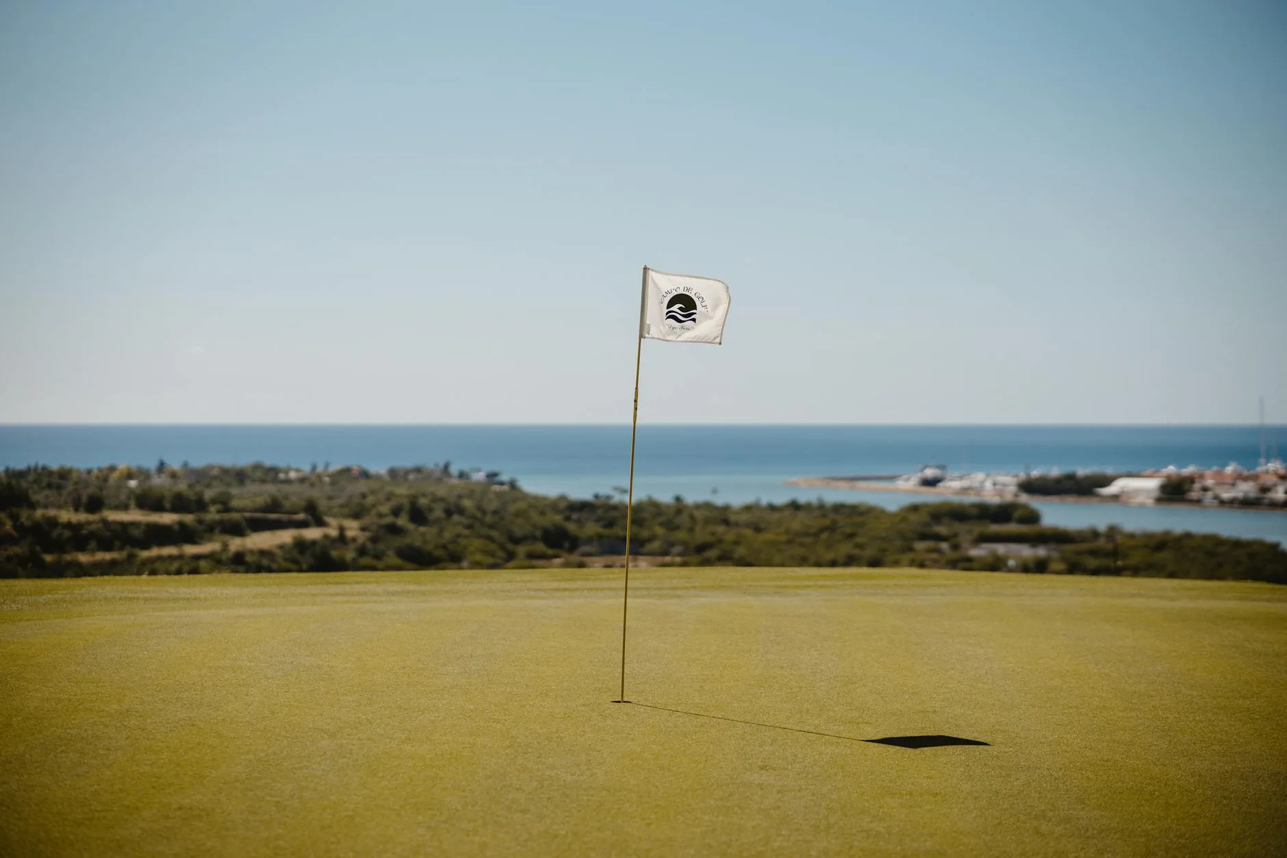 Golf ball near the hole on a putting green