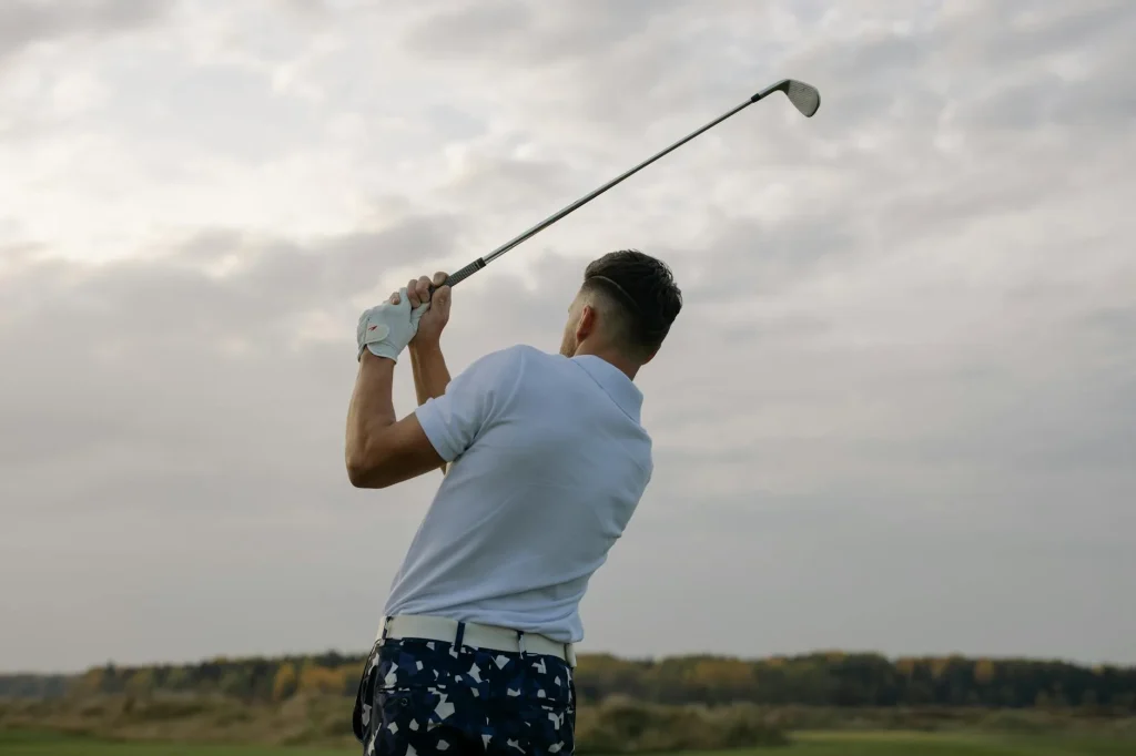 Golfer stretching and warming up on the course before a round