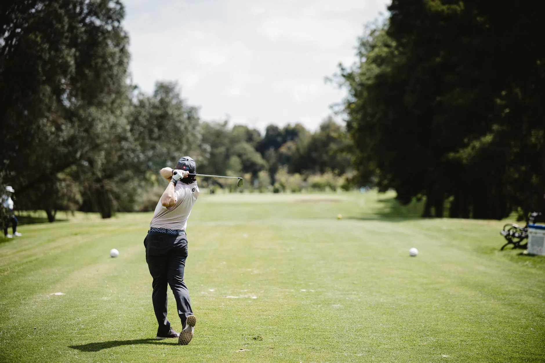 Golfer choosing a safer tee shot strategy
