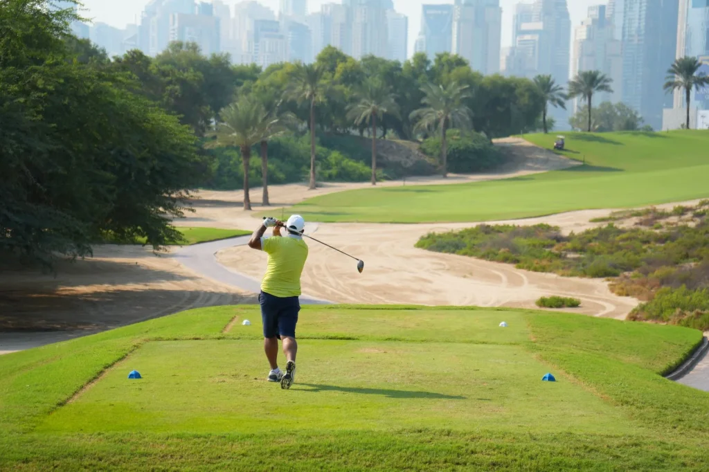 Golfer hitting a driver from the tee on a fairway
