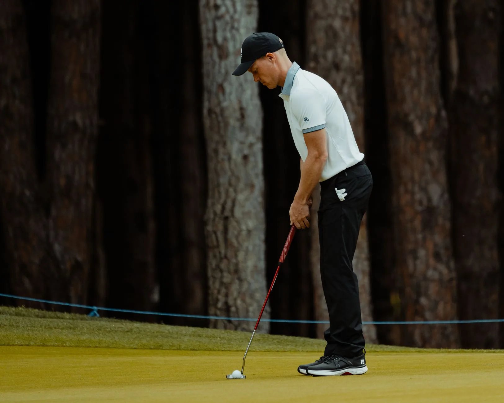 Golfer putting on a par 3 green